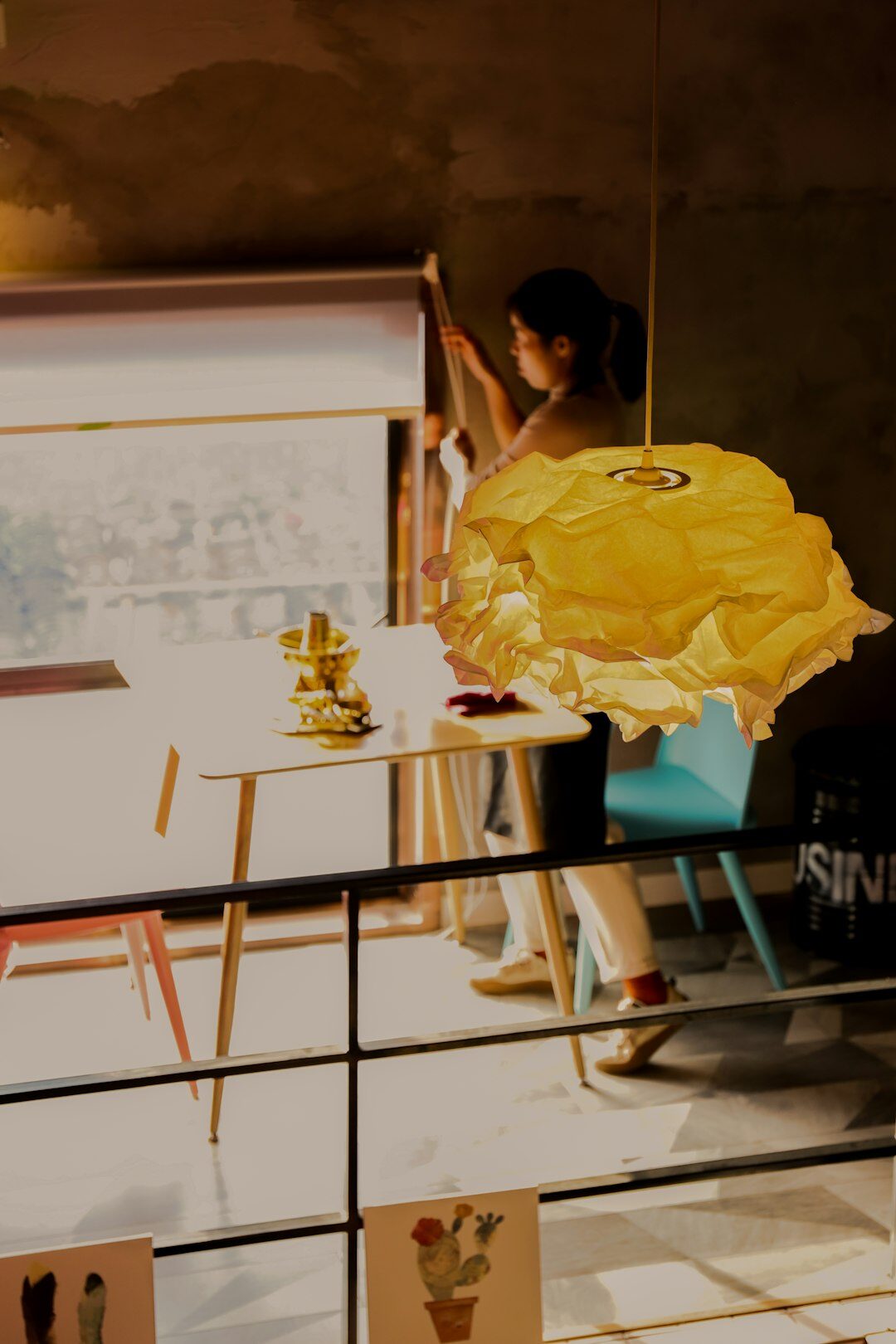 Creative agency office with designers sketching layouts on a light table